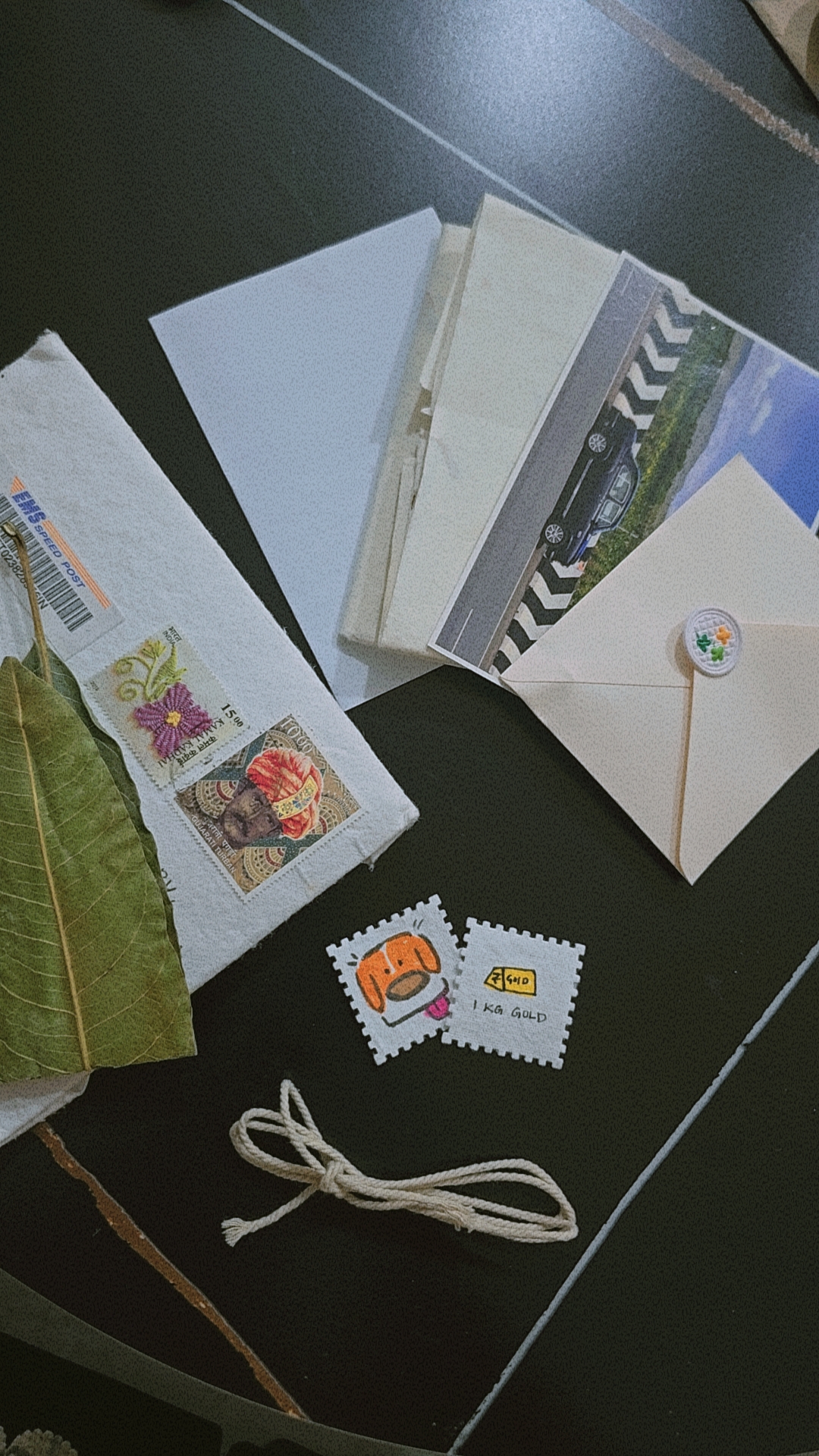 A heartfelt letter, beautiful postcard, some leaves, shell, shark tooth >~< and 1kg gold! So precious!